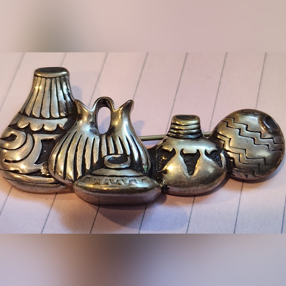 Vintage Indian baskets sterling pin. Signed and marked.
